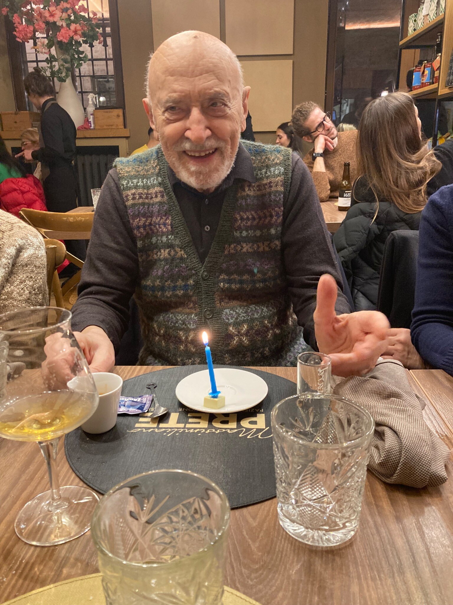 Joe Resnick smiling at a table on his birthday